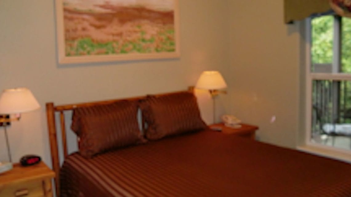 Heron Suite bedroom at Creekside Inn and Resort
